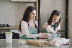 mom daughter making cookies